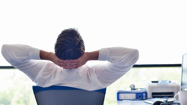 man relaxing in office chair Smartest Men Get Ahead {priorities after 50}