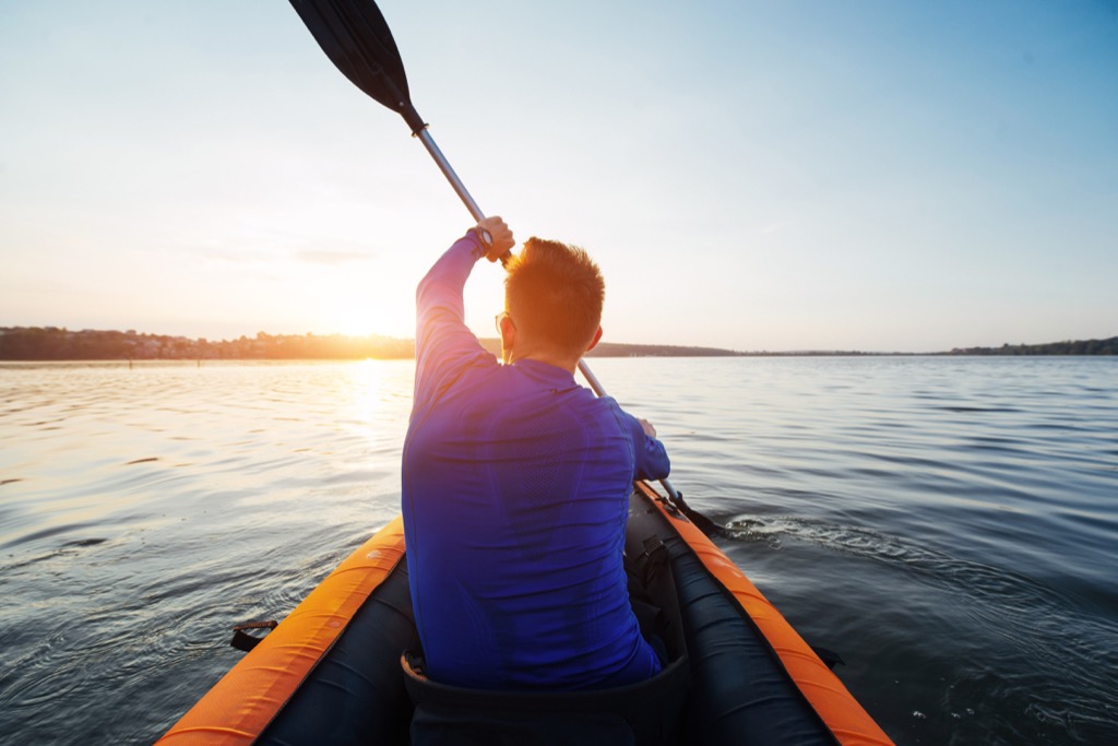 man kayaking in a lake, weight loss motivation