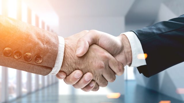 Shaking hands, which represents the dreaded raise question.