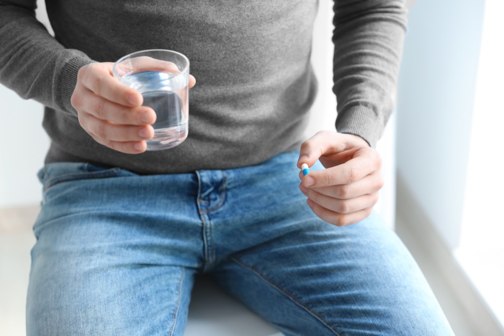 man taking pill