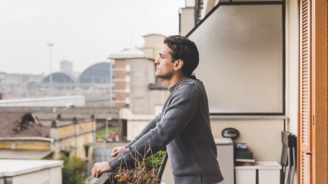 man on balcony