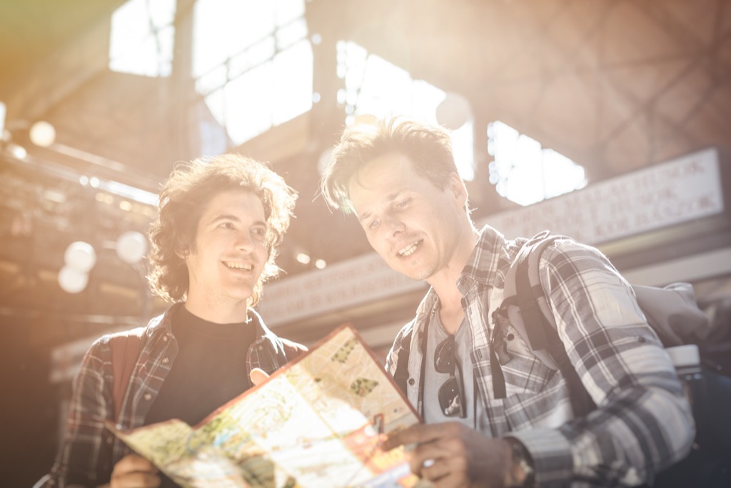 dad and son looking at a map