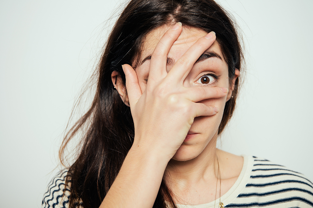keeping secrets, embarrassed woman covering her face