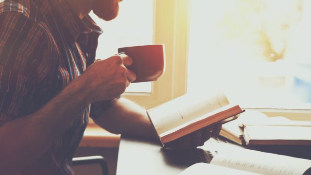 Man in his 40s reading a book