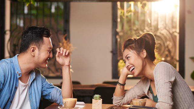 couple laughing at restaurant, f