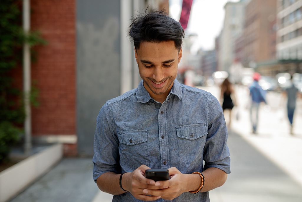 Man on Phone Sliding into DMs Slang Terms