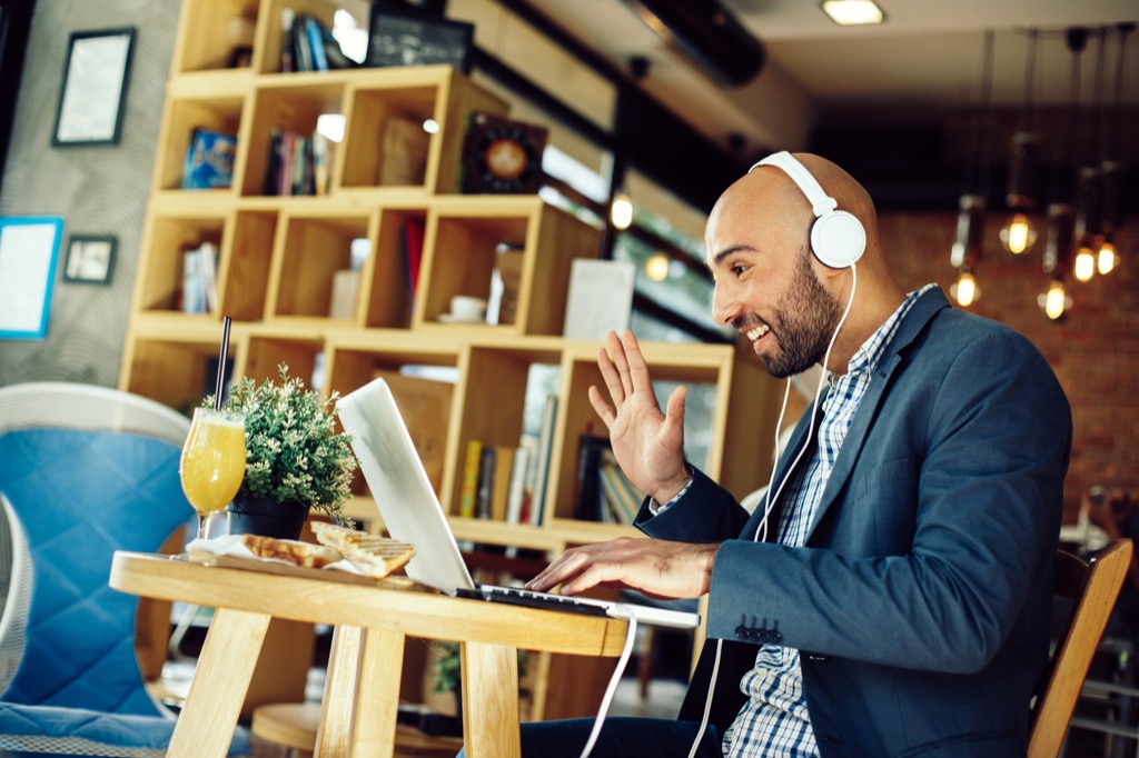 man in cafe on laptop skype facetime Financial Advisor