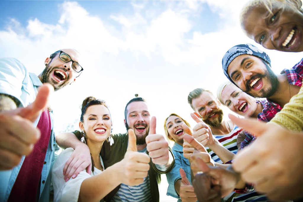 A Bunch of People with their Thumbs Up