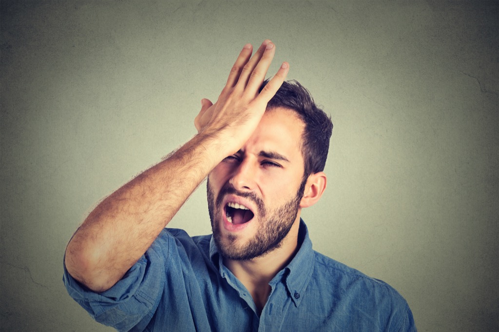 man smacking head because he understands riddle