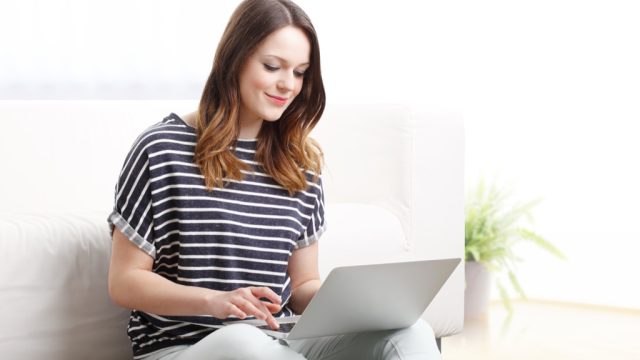 Woman typing on computer