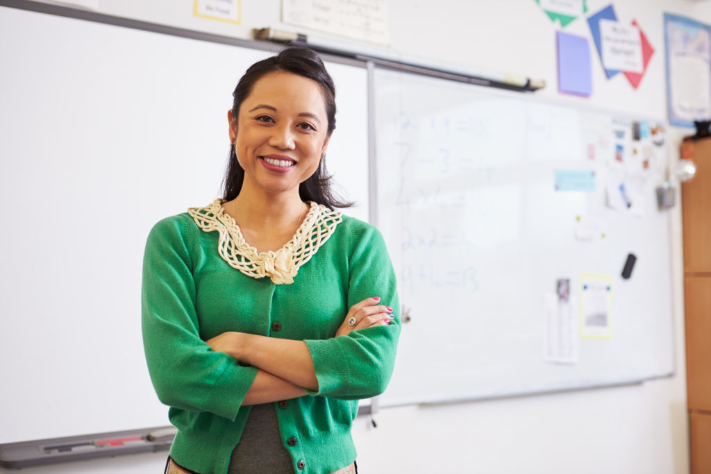 Teacher smiling in classroom