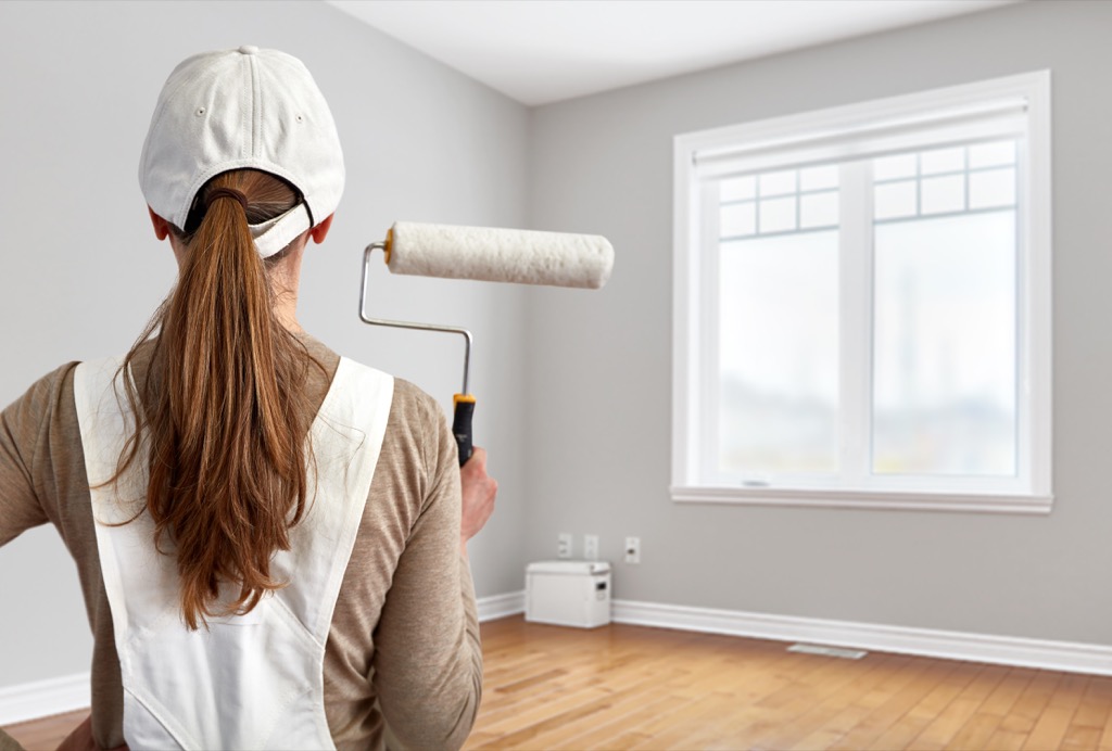 woman holding paint brush