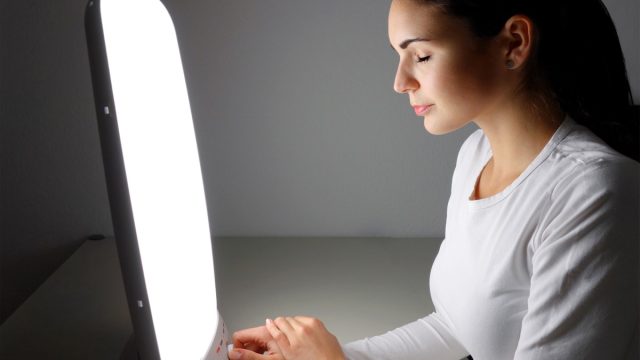 Woman getting light therapy for her seasonal depression