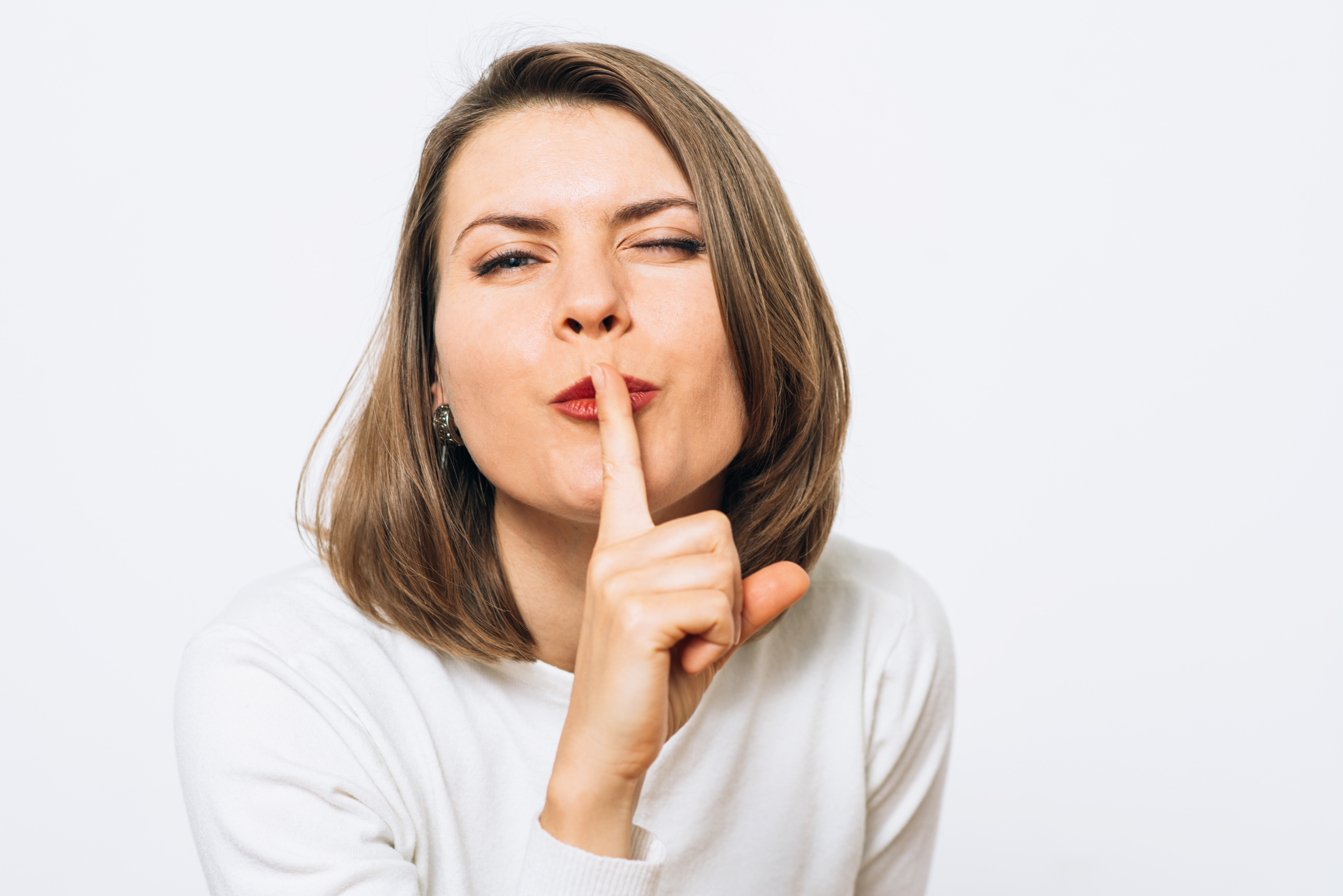 woman shushing to demonstrate riddle