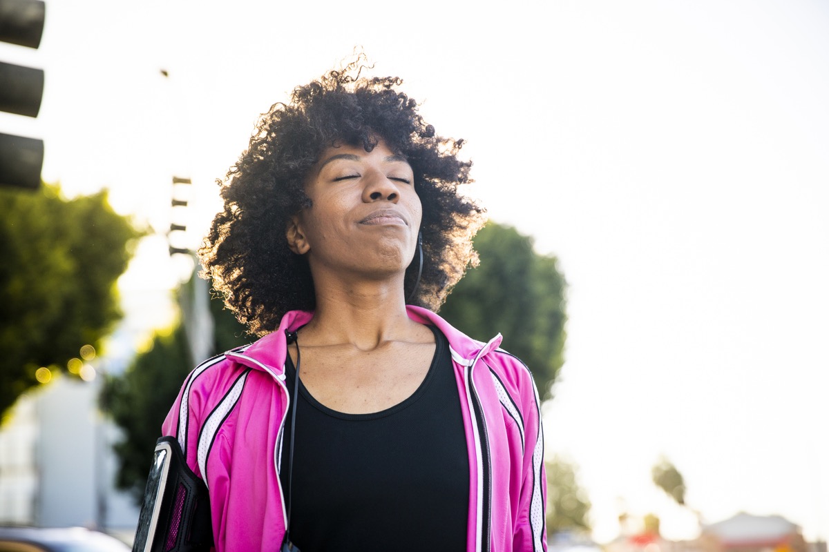Woman taking a deep breath