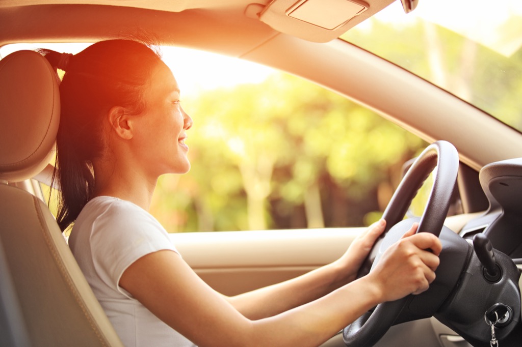 Smiling woman driving a car