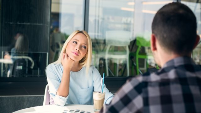 couples drinking coffee- signs hes not into you