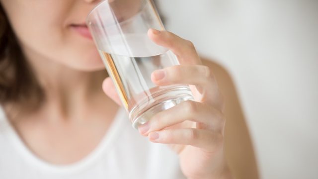 woman drinking water what happens when you don't drink enough water