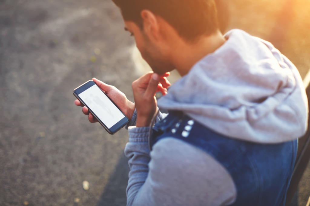 Man Checking His Texts