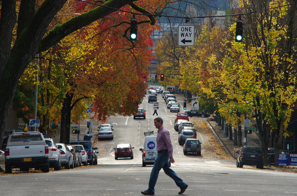 Man Jaywalking across a street in portland oregon