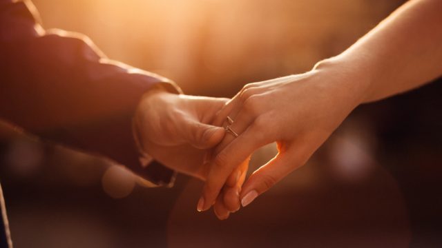 Newlyweds holding hands