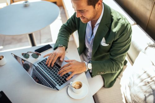 dressed man on computer