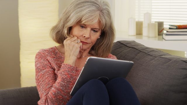older person on ipad