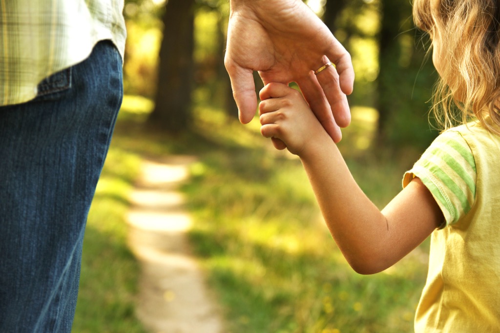father and daughter holding hands