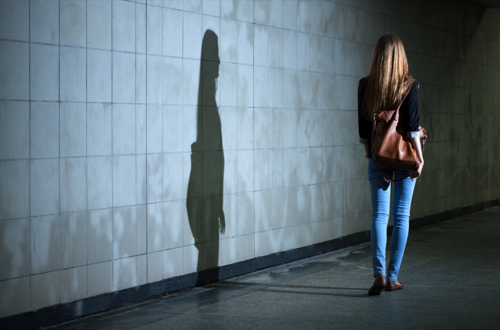 Woman walking into riddles