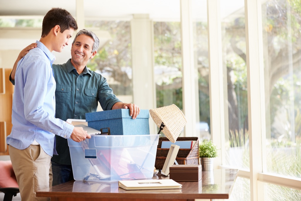 dad helping son pack for college