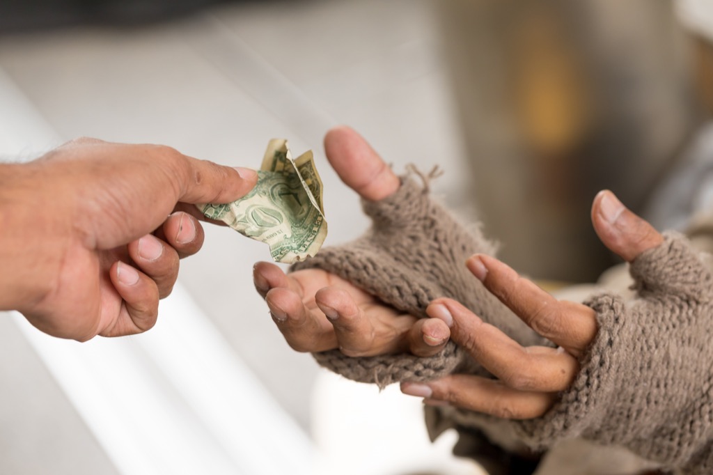 handing dollar to poor person, facts about the lottery