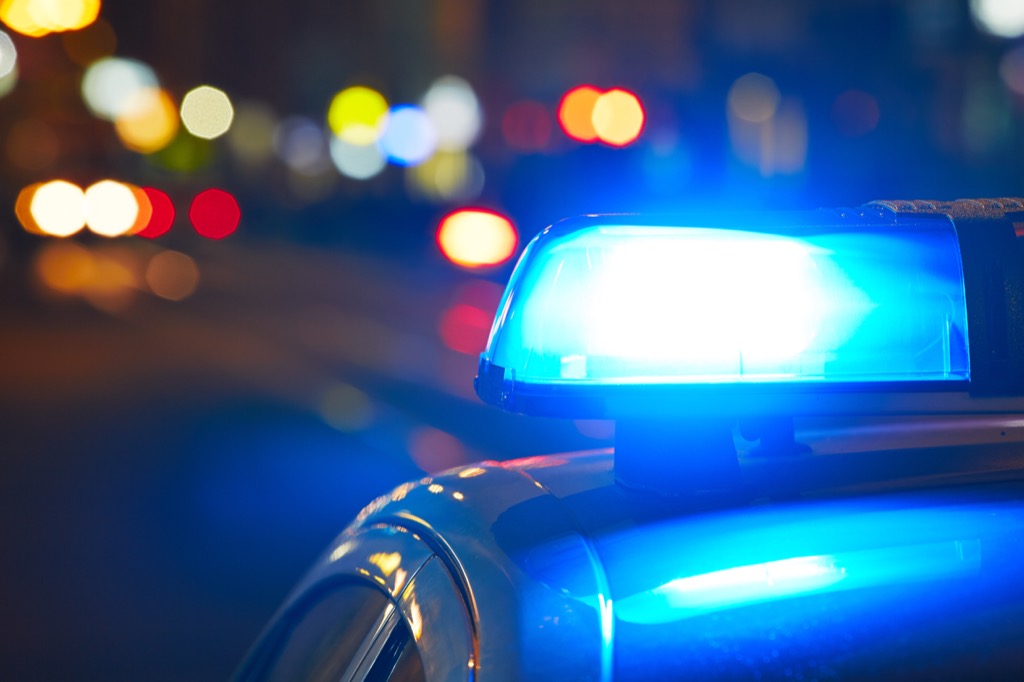 lit-up police car at night