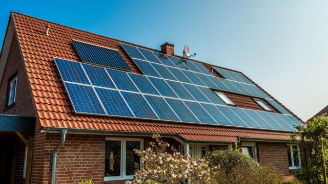 eco friendly house with solar panels roof