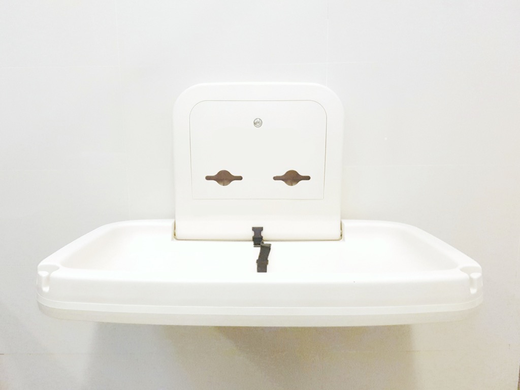 Diaper changing station in public bathroom