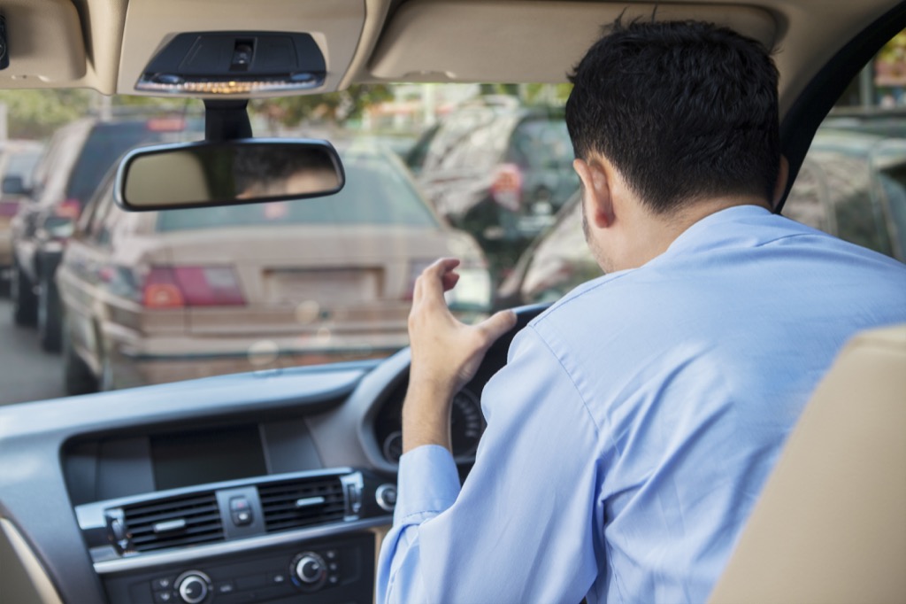 man yelling in a car