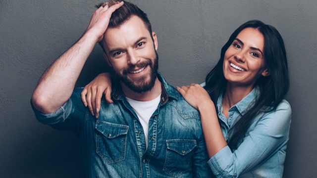 a couple with good hair wearing jean jackets