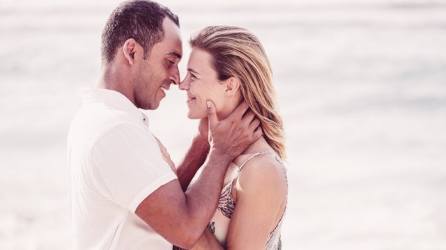middle aged couple kissing