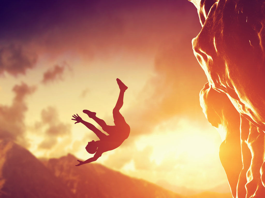 Man falling off cliff in a dream