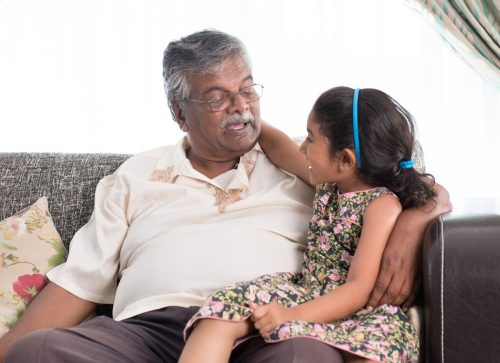 Grandfather talking to granddaughter