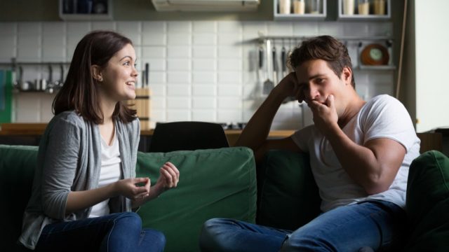 roommates talking on a sofa