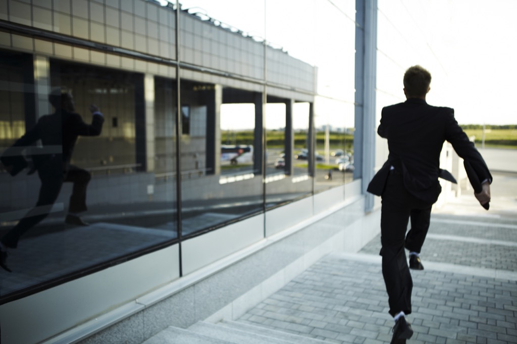Man in suit running away from something