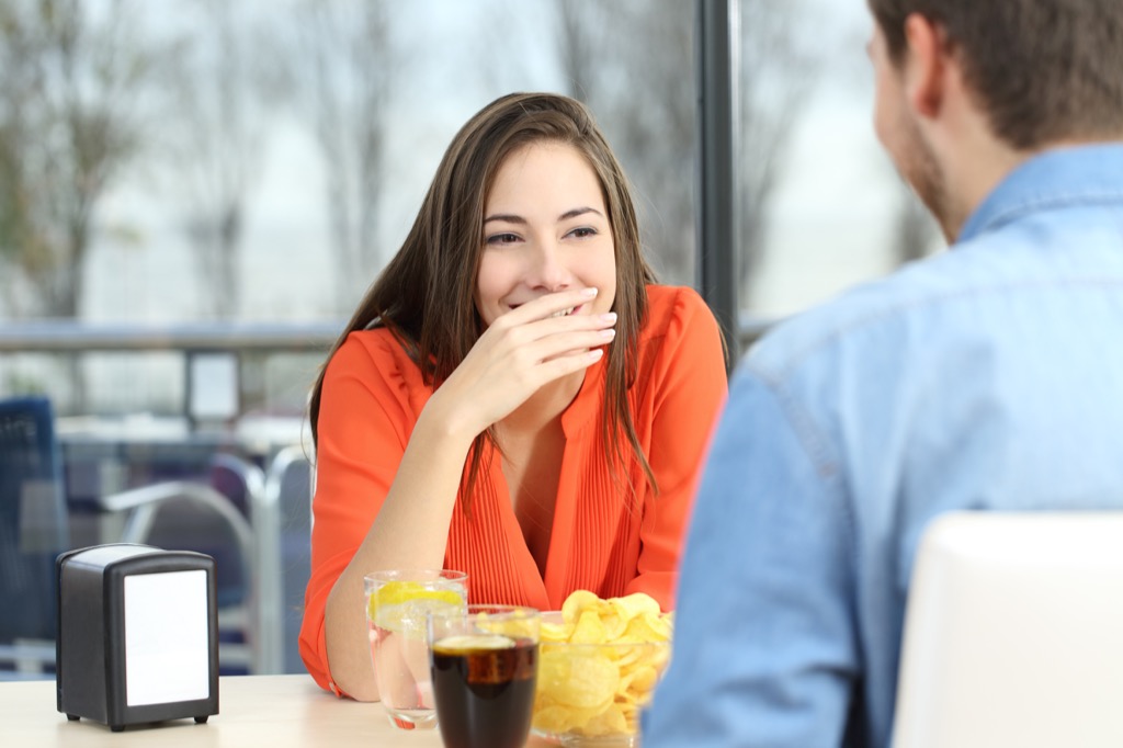 woman laughing at man