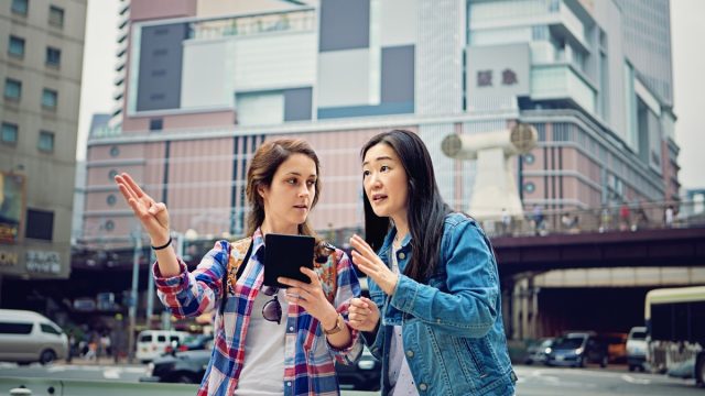 Young caucasian girl is lost in Japan and asking local mature woman for help