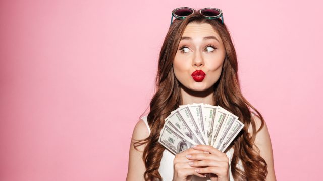 Woman holding cash