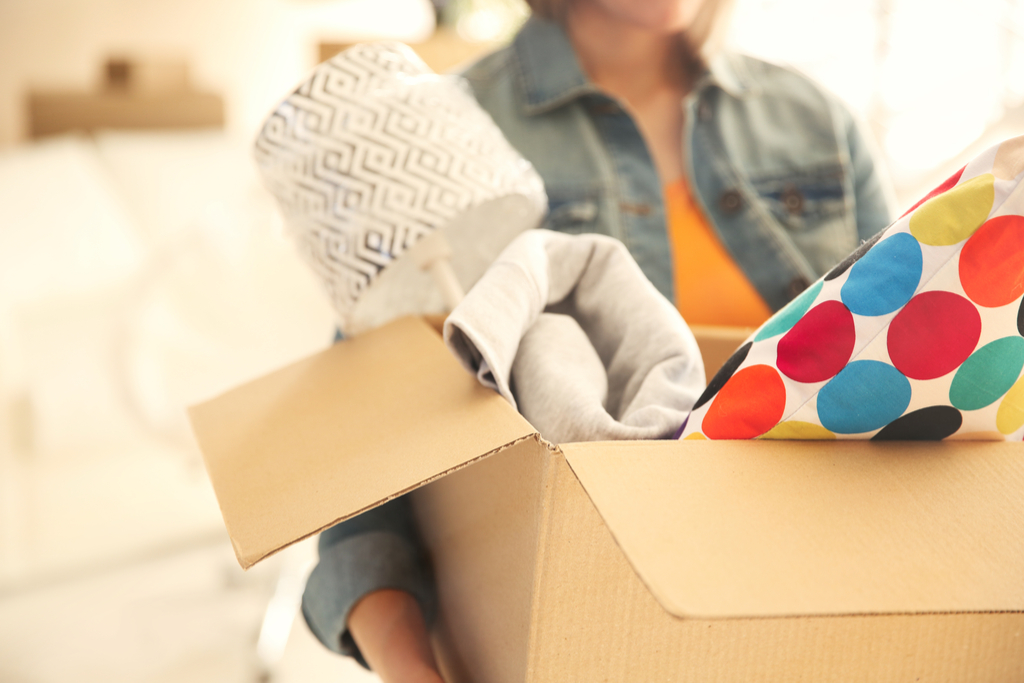 Woman with Box of Momentos Signs Your Partner Misses Her Ex