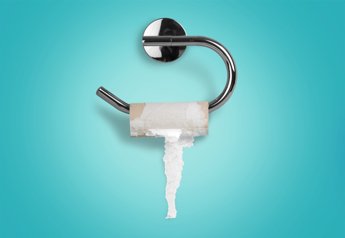 an empty roll of toilet paper against a blue background, etiquette after 40