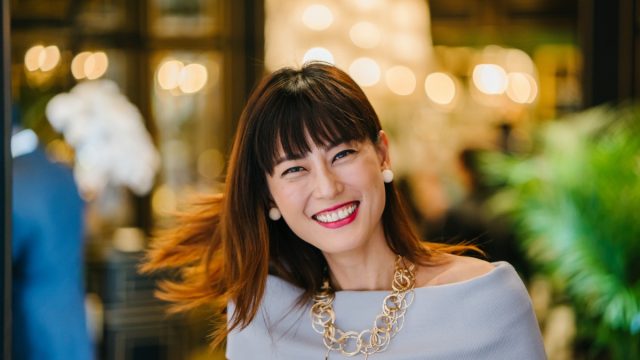 fashionable older asian woman smiling