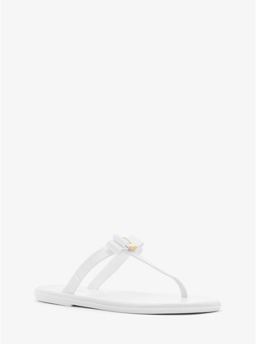 white flip flops with a bow