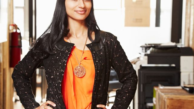 Woman with hands on hips, showing confident body language