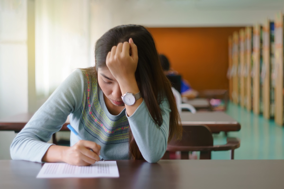 Tired girl taking test